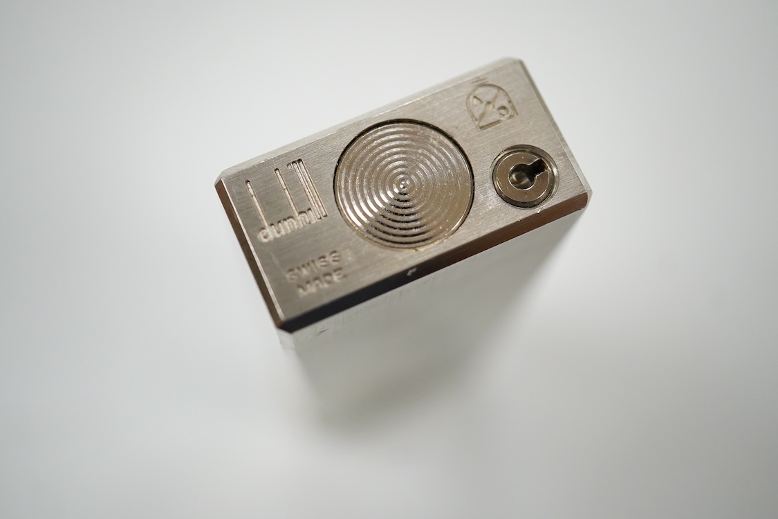 A boxed Dunhill Rollagas with brushed palladium finish and contrasting metal ignition roller-6cm high